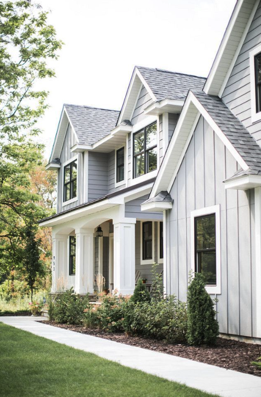siding replacement Goochland County modern home exterior with new vinyl siding and greenery